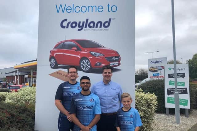 Pictured with Croyland Car Megastore general manager Mark Swindells are Higham Town's vice-chairman James Sharp with players Josh Dhir and Brayden Mackness, who play in the adults and U9s teams