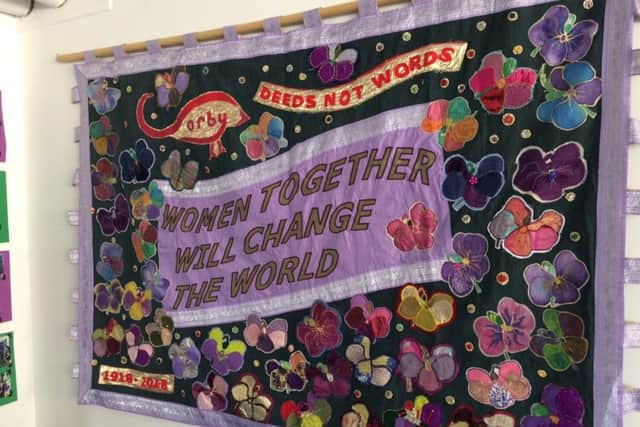 A banner made by women across Corby to celebrate 100 years since women gained the vote
