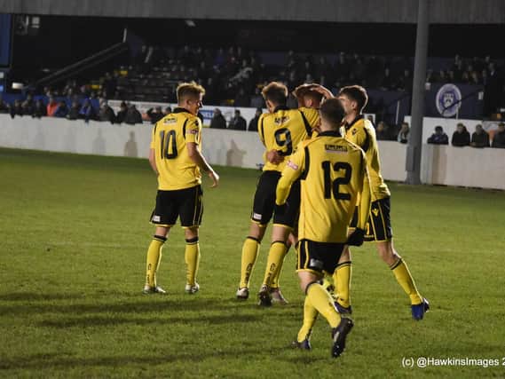 Ben Farrell takes the congratulations after his late penalty earned AFC Rushden & Diamonds a 1-1 draw at Lowestoft Town. Pictures courtesy of HawkinsImages