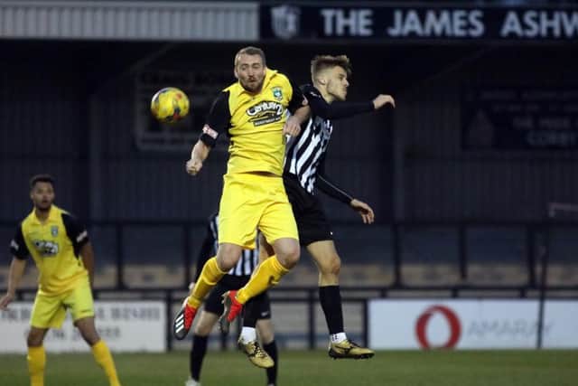 Ben Bradshaw goes up to win a header