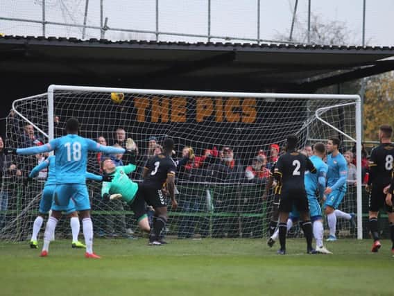 Michael Richens' header hits the net as the Kettering Town captain grabbed the only goal of the game to secure a 1-0 success at Rushall Olympic. Pictures by Peter Short
