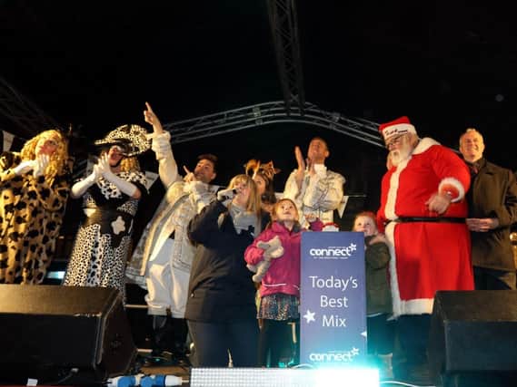 Mia and Bella Pettit switch on the lights (Picture: Alison Bagley)