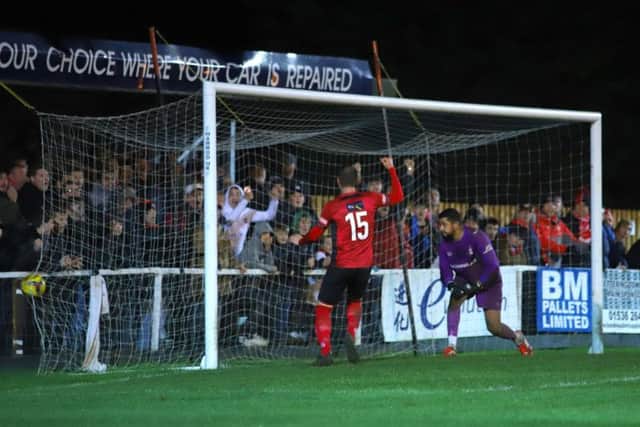 Dan Holman's header finds the corner for his first and Kettering Town's third goal in the 4-4 draw with Redditch United. Pictures by Peter Short