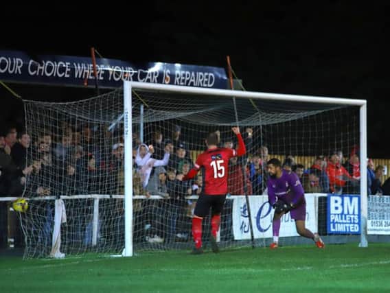 Dan Holman's header finds the corner for his first and Kettering Town's third goal in the 4-4 draw with Redditch United. Pictures by Peter Short