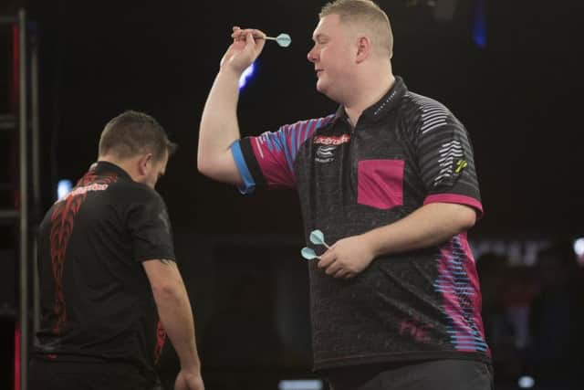 Ricky Evans in action during his 10-5 defeat to Jonny Clayton in the Ladbrokes Players Championship Finals. Picture courtesy of Lawrence Lustig/PDC