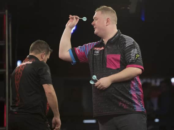 Ricky Evans in action during his 10-5 defeat to Jonny Clayton in the Ladbrokes Players Championship Finals. Picture courtesy of Lawrence Lustig/PDC