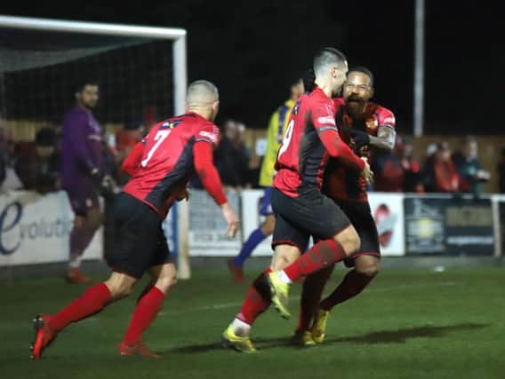 Dan Holman celebrates one of his two goals in Kettering Town's 4-4 draw against Redditch United. Picture by Peter Short