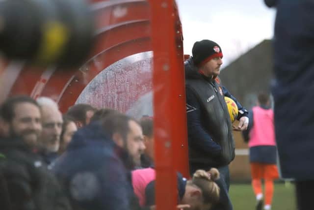 A glum-faced Marcus Law watches on during the Poppies' 3-0 loss to St Ives at Latimer Park