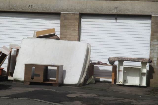 A mattress and furniture was left next to garages in Harlech. NNL-181218-104714005