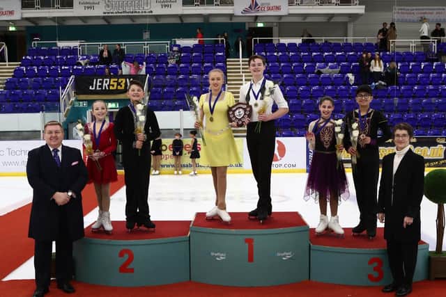 Corbys Stanley Evans and his ice dance partner Olivia Jenkinson stand on the top podium after their success in Sheffield