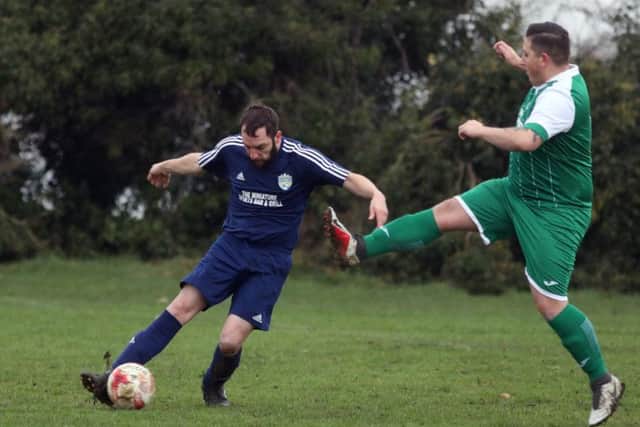 Action from the Division Four clash between Great Doddington and Kettering All Stars