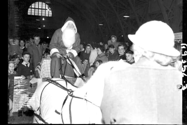 Father Christmas arrives at the Mercury Merry Comrades Christmas Bazaar at the Drill hall, Clare Street, Northampton, November 19, 1960