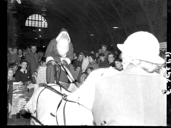Father Christmas arrives at the Mercury Merry Comrades Christmas Bazaar at the Drill hall, Clare Street, Northampton, November 19, 1960