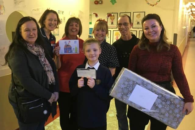 Back Row Left to Right: Christina Godding (Ward Sister), Lynda Anderson (Play Team), Michelle Soper-Burford (Ward Clark), David (Leos Dad)Front Row left to right: Tracey (Leos Mum), Leo (Competition Winner), Kristie Monaghan (Premier Roofing Systems Ltd, Director) NNL-181221-105258005