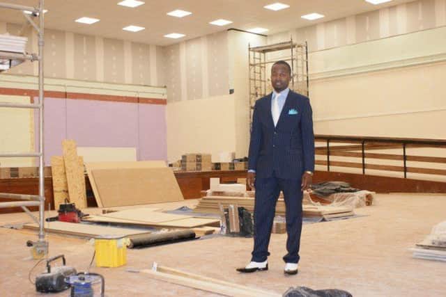 Pastor David Midzi with work under way in the former sports hall in the Connaughty Centre NNL-181221-152423005