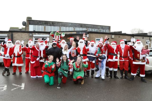 Santa Walk: Corby: Viking Club Santa Walk sets off to KGH Skylark Ward on a sponsored walk.
Monday December 24th 2018 NNL-181224-163219005