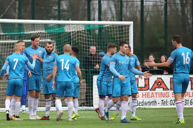 Kettering Town celebrate one of their goals during their Boxing Day win at Bedworth United. Pictures by Peter Short