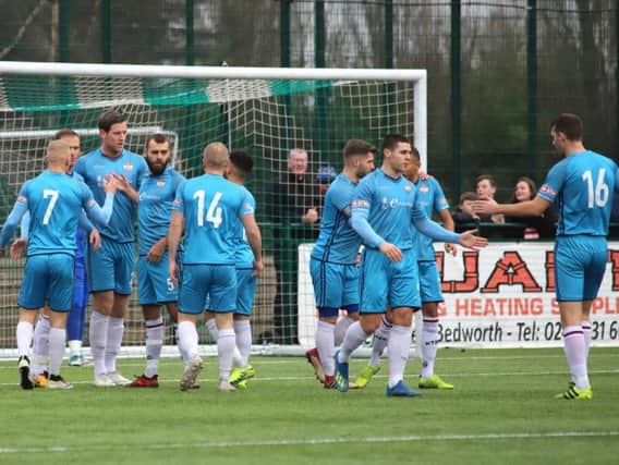 Kettering Town celebrate one of their goals during their Boxing Day win at Bedworth United. Pictures by Peter Short