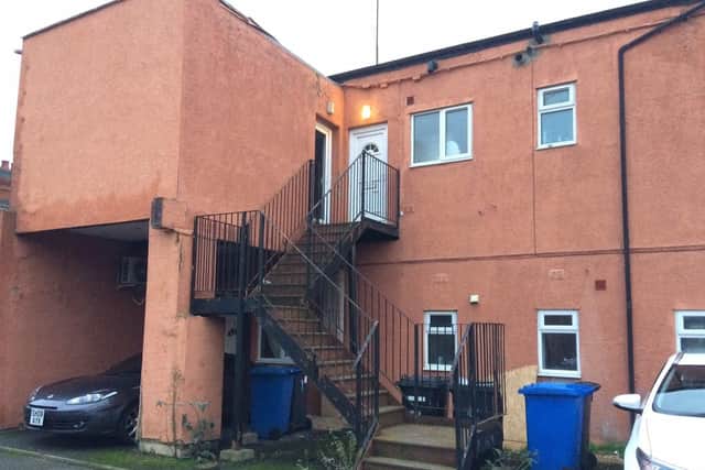 The victim died in the first floor flat on the left of the picture.