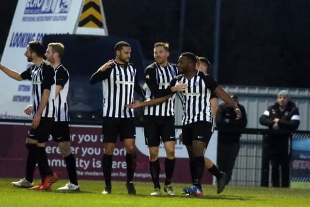 Tolani Omotola takes the congratulations after he grabbed his first goal for Corby