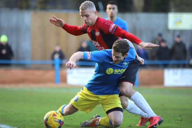 Lindon Meikle battles for possession at The Walks