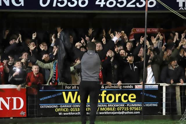 Marcus Law celebrates in front of the delighted Kettering Town fans after the 2-1 victory over AFC Rushden & Diamonds at Latimer Park. Pictures by Peter Short