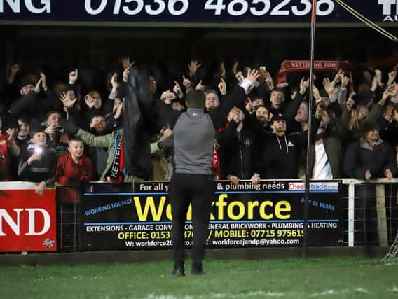 Marcus Law celebrates in front of the delighted Kettering Town fans after the 2-1 victory over AFC Rushden & Diamonds at Latimer Park. Pictures by Peter Short