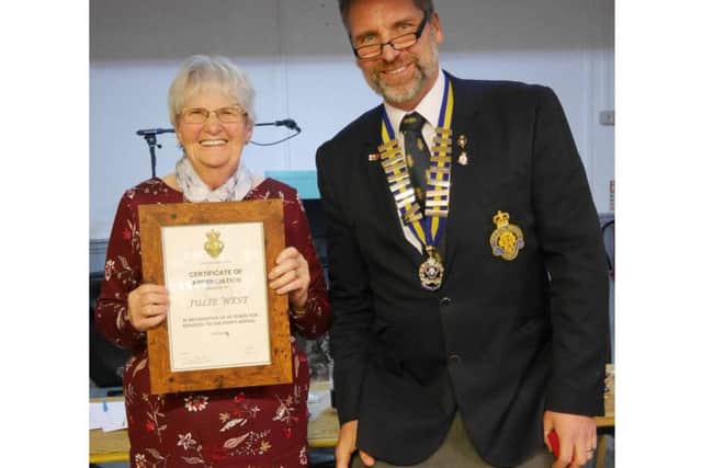 Julie West and Rushden Royal British Legion branch chairman Paul Mills