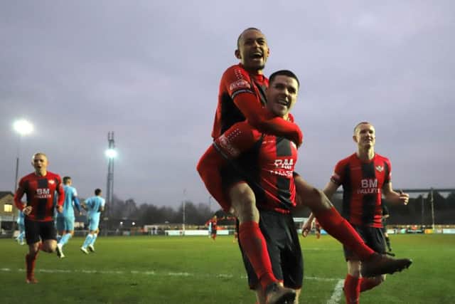 Goalscorer Dan Holman gives a lift to Rhys Hoenes after Kettering Town's second goal in the 2-1 success over Tamworth at Latimer Park. Picture by Peter Short