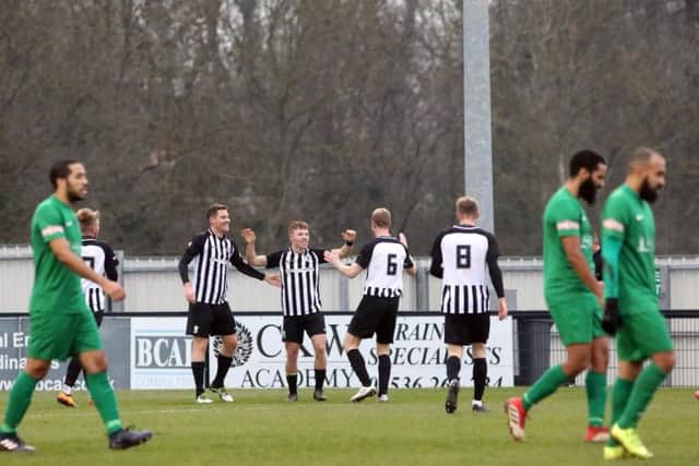 Jordon Crawford takes the congratulations after he opened the scoring in Corby Town's 3-1 success over Kidlington. Pictures by Alison Bagley