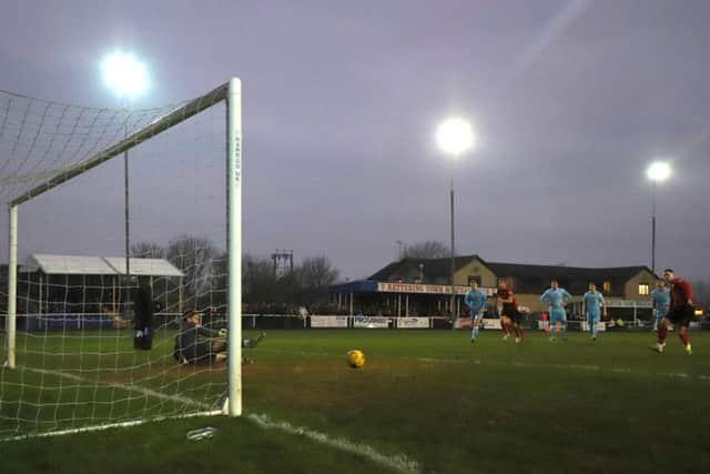 Dan Holman scores what proved to be the winner from the penalty spot as Kettering Town beat Tamworth 2-1 at Latimer Park. Pictures by Peter Short
