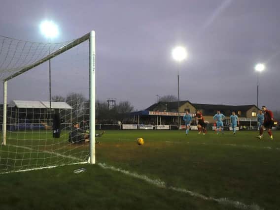 Dan Holman scores what proved to be the winner from the penalty spot as Kettering Town beat Tamworth 2-1 at Latimer Park. Pictures by Peter Short