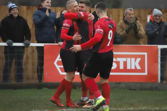 Lindon Meikle celebrates his goal with Michael Richens and Dan Holman