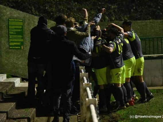 The AFC Rushden & Diamonds players and fans celebrate their stoppage-time winner in the incredible 4-3 success at Hitchin Town. Pictures courtesy of HawkinsImages