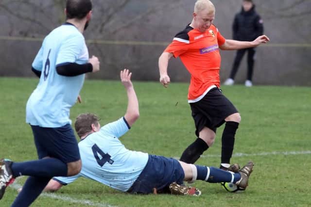 Action from the NFA Junior Cup quarter-final between Kettering Nomads and Rushden & Higham United, which the former eventually won in a penalty shoot-out. Pictures by Alison Bagley