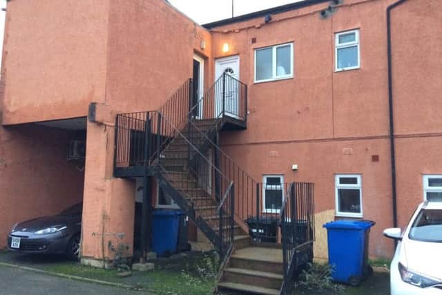 The victim died in the first floor flat on the left of the picture. NNL-181228-174723005 NNL-181228-174723005