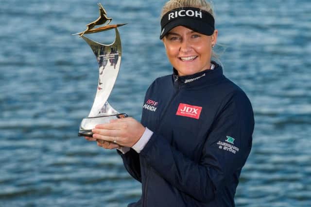 Charley Hull shows off the trophy after she claimed victory in the Fatima Bint Mubarak Ladies Open. Picture courtesy of Tristan Jones/Ladies European Tour (LET)