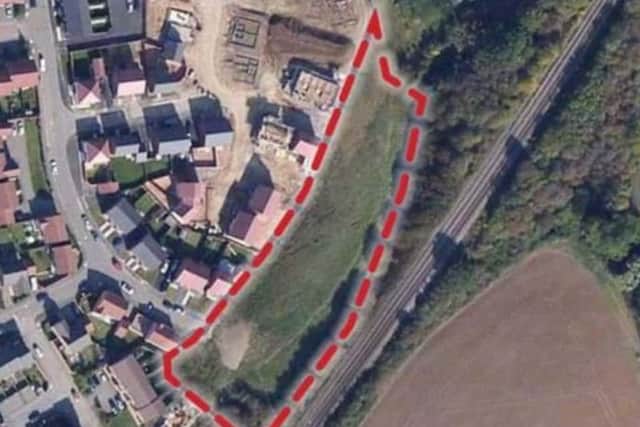 An overhead view of the plot off Cheltenham Road in Corby. The railway line can be seen to the right, and Cheltenham Road to the left.
