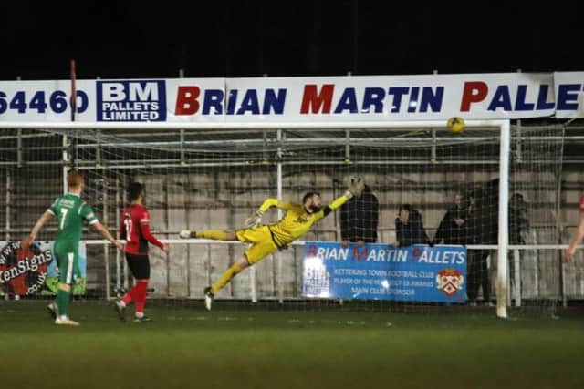 Paul White is beaten by Ben Walster's free-kick, which put Biggleswade Town 2-1 up at Latimer Park. Pictures by Peter Short
