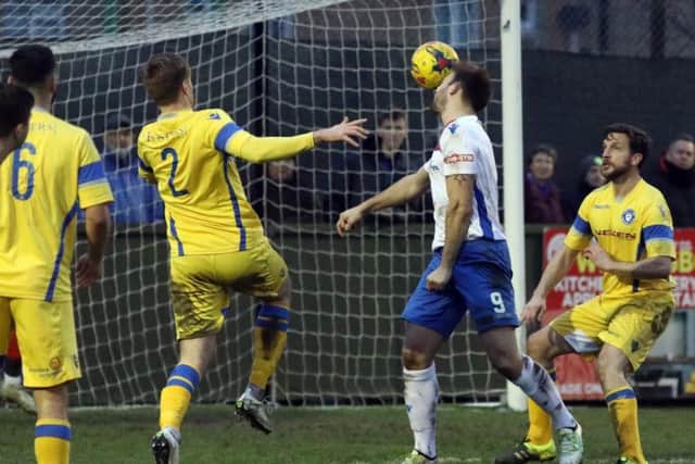 Tom Lorraine gets his head on the ball for Diamonds at Hayden Road