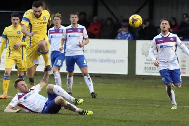 Ben Farrell slides in to make a challenge during Diamonds' 1-1 draw with Lowestoft Town in which the midfielder grabbed his team's goal from the penalty spot
