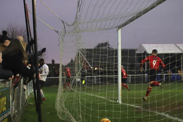 The ball is in the net and the celebrations begin after Aaron O'Connor scored the only goal of the game to give Kettering Town a 1-0 victory over Royston Town at Latimer Park. Picture by Peter Short