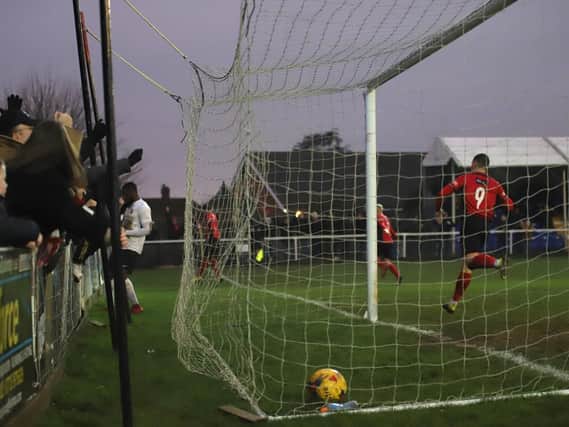 The ball is in the net and the celebrations begin after Aaron O'Connor scored the only goal of the game to give Kettering Town a 1-0 victory over Royston Town at Latimer Park. Picture by Peter Short