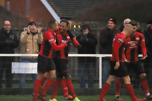 Aaron O'Connor takes the congratulations after he scored the only goal of the game in Kettering Town's 1-0 success over Royston Town. Pictures by Peter Short