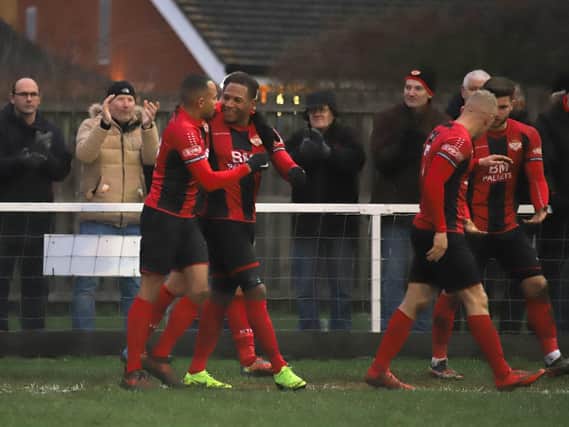 Aaron O'Connor takes the congratulations after he scored the only goal of the game in Kettering Town's 1-0 success over Royston Town. Pictures by Peter Short