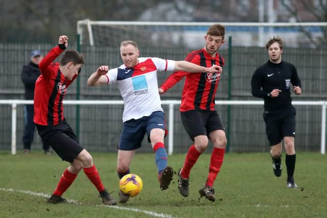 Whitworth and ON Chenecks battle for possession