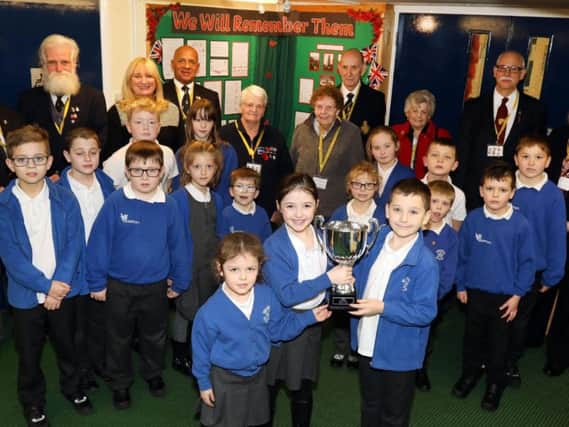 Whitefriars Primary school are presented with the Poppy Cup in the company of Rushden Royal British Legion members