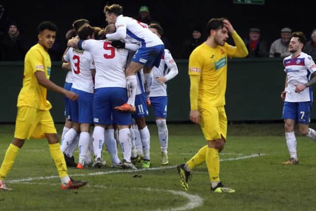 Ben Diamond is mobbed by his team-mates after he put AFC Rushden & Diamonds in front against Banbury United. Pictures by Alison Bagley