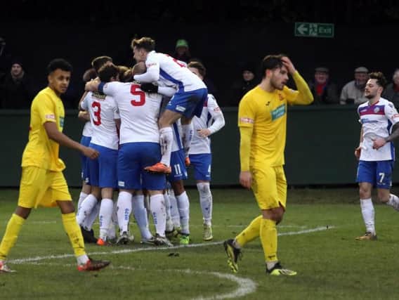 Ben Diamond is mobbed by his team-mates after he put AFC Rushden & Diamonds in front against Banbury United. Pictures by Alison Bagley