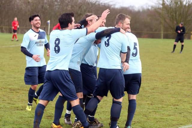 Kettering Nomads celebrate after Darren Capps gave them the lead in their NFA Junior Cup semi-final success over Sileby Rangers at Orlingbury Road. Pictures by Alison Bagley